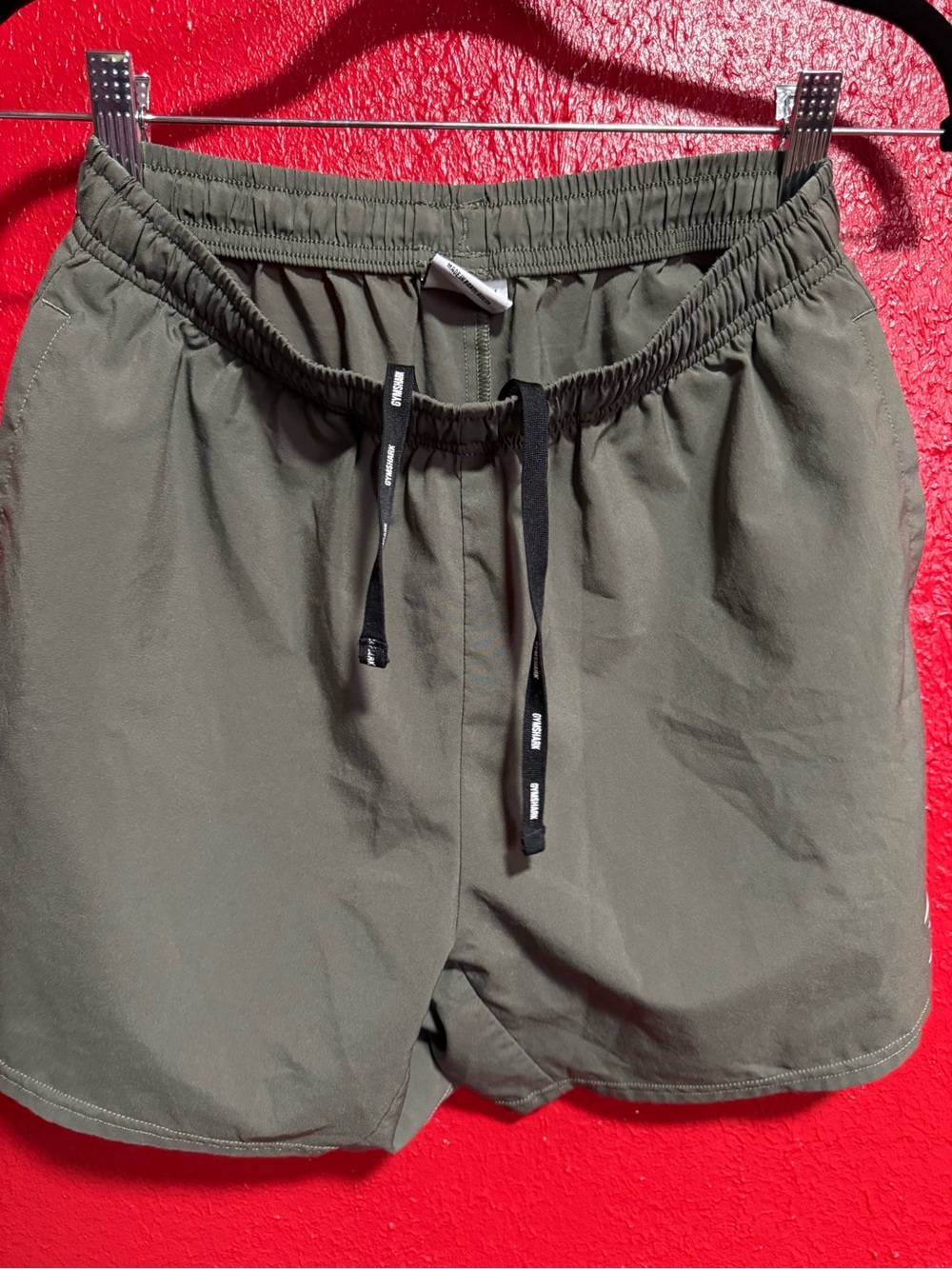 27. Preloved Men’s Gymshark Olive Green Athletic Drawstring Shorts